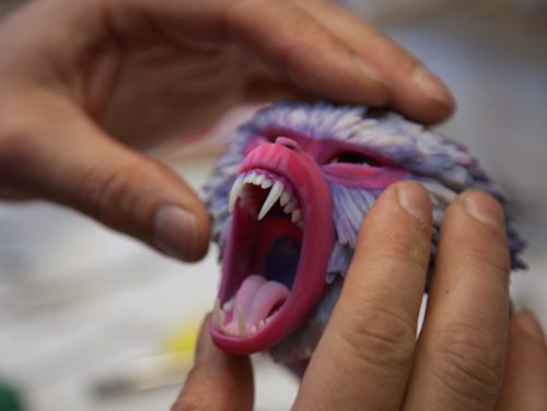 An animator at LAIKA works to construct Monkey's face. 